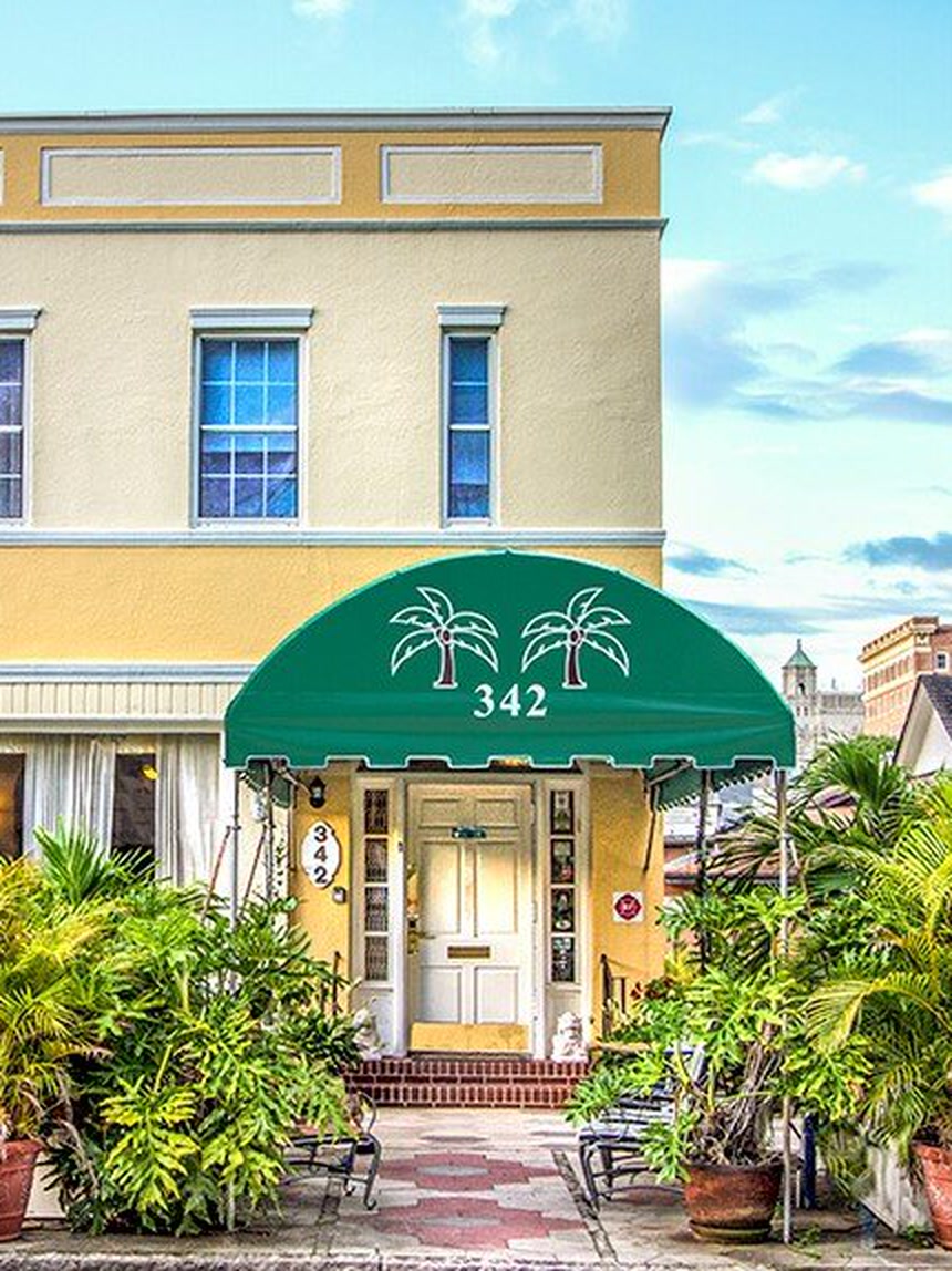 The green 342 awning and entrance to The Inn On Third