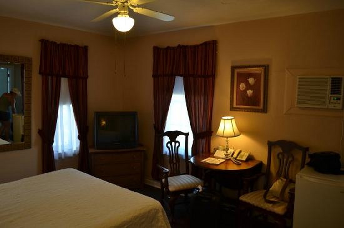 Guest room with warm wood furniture